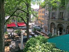 Place du Bourg de Four in Geneva with historic buildings and outdoor cafes