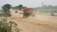A scenic road inside Pobitora Wildlife Sanctuary