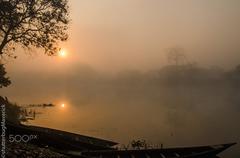 Morning mist at riverside of Pobitora Wildlife Sanctuary in Guwahati, India