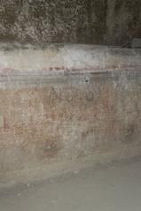 Underground wall in Naples with visible water level markings