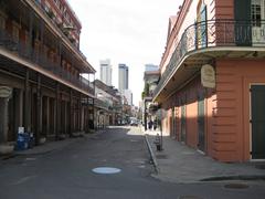 View of Chartres Street in the French Quarter, New Orleans, showing Upper Pontabla Building on the left and Le Petit Theater on the right