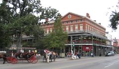 horse carriages in front of Lower Pontabla Building in Jackson Square, New Orleans