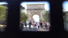 View of Arch of Titus through a fence