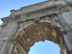 Close-up view of the Arch of Constantine from below in Rome