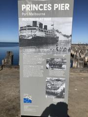 Information board at Princes Pier, Melbourne with historical details about Port Melbourne's role in the world wars.