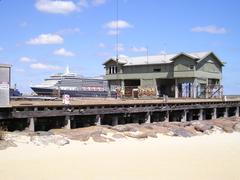 Renovation work at Princes Pier with MS Queen Victoria berthed at Station Pier in the background