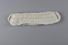 Dambinda made of soft cotton yarn, folded in three layers, with crocheted ends forming loops