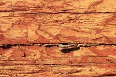 old wall with worn red and yellow paint