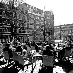 scenic view of the Amsterdam canals with historical buildings and boats