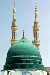 Madina Munawara in Saudi Arabia at night with illuminated mosque and surrounding buildings