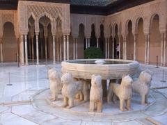 Courtyard of the Lions in the Alhambra with central fountain and surrounding lion statues