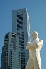 Statue of Stamford Raffles with skyscrapers in the background in Singapore