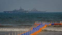 Newly constructed floating bridge of Visakhapatnam with Indian Naval ships in the background