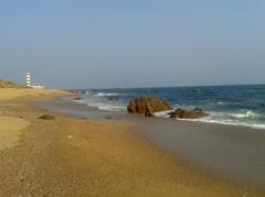 A midday view of Ramakrishna Mission Beach with clear blue sky in Visakhapatnam