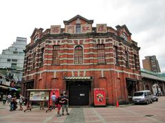 Ximen Red House Octagon Building front view with Mitsubishi Delica van