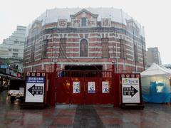 Red House Theater octagonal building under restoration in the rain