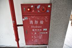 fire hydrant with graffiti stickers at Ximen Red House Theater