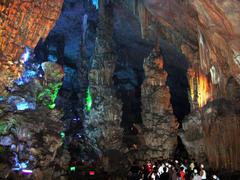 Reed Flute Cave in Guilin, China with visitors for scale