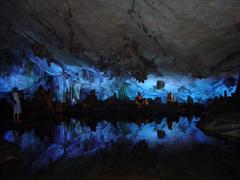 Reed Flute Cave reflecting lake with mirror-like water