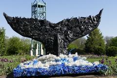 whale sculpture made from trash