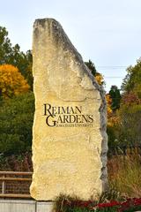 Reiman Gardens at Iowa State University with lush greenery, flowers, and a winding pathway