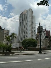 Street view of Rua Alvaro de Carvalho with buildings and parked motorcycles