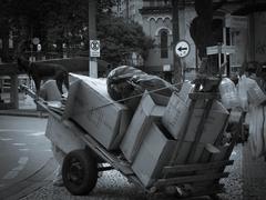 Homeless person carrying cardboard cart in São Paulo