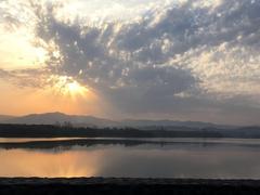 Sukhna Lake in Chandigarh during sunset with migratory birds