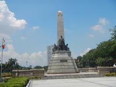 La Madre Filipina statue in Rizal Park with nearby landmarks and historical markers