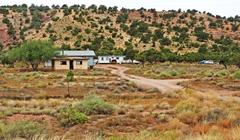 Family compound in Navajo Nation, Arizona with mountains in the background