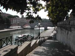 Boat boarding on the Tiber River in Rome with Ponte Cestio and Tiber Island in the background