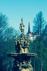 Ross Fountain in Princes Street Gardens, Edinburgh, with lush greenery and historic buildings in the background