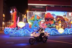 Aetos officer escorts NUS parade float at 2014 Chingay Parade