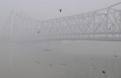 Howrah Bridge on a foggy morning in Kolkata, India