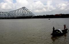 Howrah Bridge over the Hooghly River in Kolkata at dusk