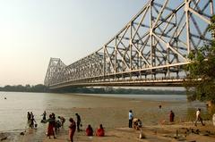 Howrah Bridge with people performing ablutions in the Hooghly River