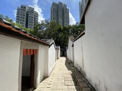 Sam Tung Uk museum entrance with greenery and clear blue sky