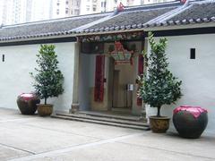 traditional Chinese courtyard house with white walls and tiled roofs