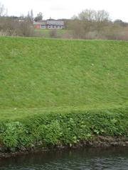 Bund separating RSPB Sandwell Valley from the river Tame and Sandwell Valley Country Park