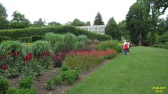 beautiful pathway surrounded by vibrant flowers and lush greenery in the Savill Garden