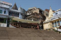 Ghats in Varanasi during sunrise with boats and people