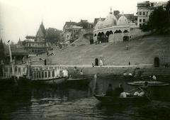 Scindia Ghat in Varanasi with temples, residences, and boats on the Ganges River