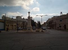 an ancient Roman cross with detailed carvings known as Salib Dejma