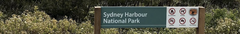 Sydney Harbour National Park entrance sign at the corner of Darley Road and North Head Scenic Drive