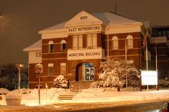 East Rutherford Municipal Building at night during snowfall