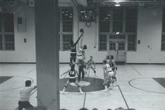 High school basketball players during a tip-off in a game between East Rutherford and Leonia in 1971