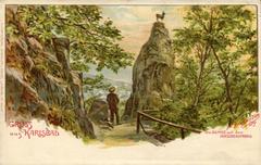 Vintage postcard titled 'Gruss aus KARLSBAD' featuring a chamois on a cliff named HIRSCHENSPRUNG by Erwin Spindler