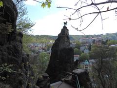 view from Kamzík with a scenic forest landscape and a distant city skyline