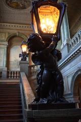 Royal Palace in Oslo, Norway with lush green lawns and tourists