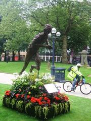 Statue of sprinter in motion at St Philip's Churchyard